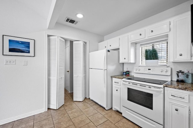 kitchen with visible vents, white appliances, white cabinetry, and baseboards