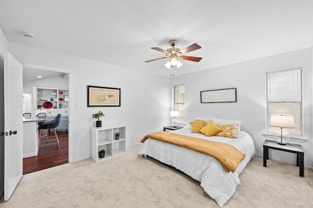 bedroom with carpet flooring, a ceiling fan, and baseboards