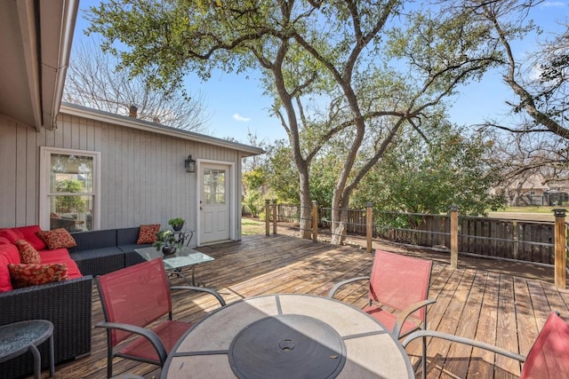 deck featuring outdoor dining space, an outdoor living space, and fence