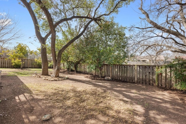 view of yard with a fenced backyard