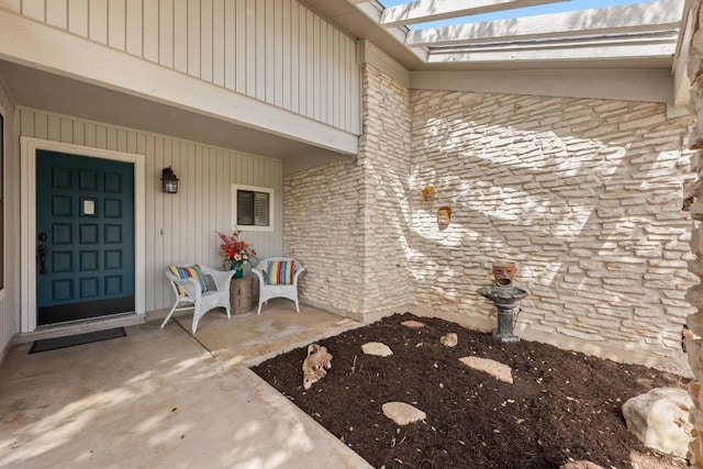 view of exterior entry with stone siding