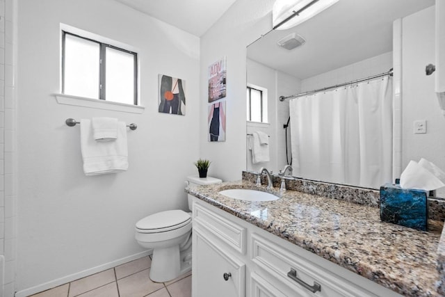 bathroom with vanity, baseboards, visible vents, tile patterned floors, and toilet