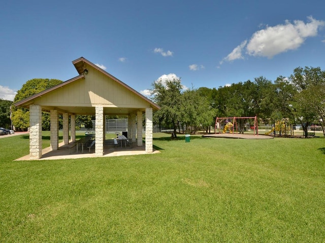 view of community featuring a gazebo, a patio, playground community, and a yard