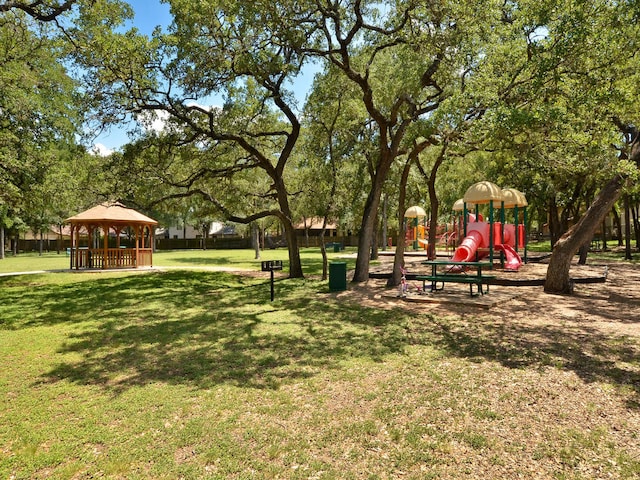 view of community with a gazebo, a yard, and playground community