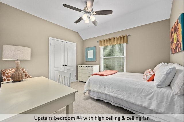 bedroom with vaulted ceiling, light colored carpet, a closet, and ceiling fan