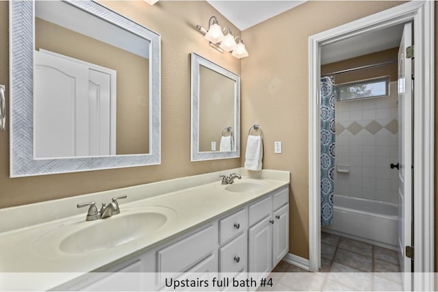 full bathroom featuring tile patterned flooring, double vanity, shower / tub combo with curtain, and a sink