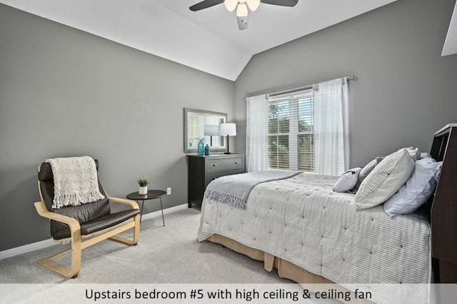 carpeted bedroom with baseboards, ceiling fan, and vaulted ceiling