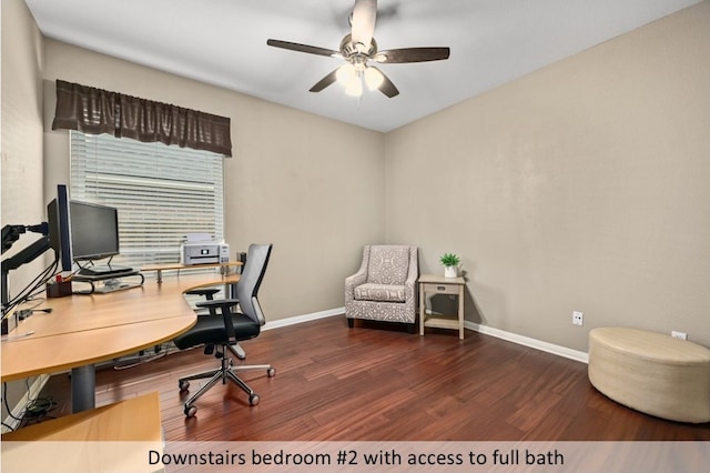 office space featuring a ceiling fan, wood finished floors, and baseboards