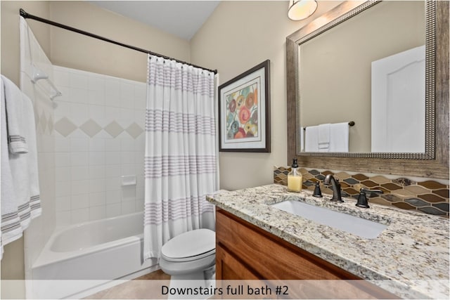 full bath featuring vanity, toilet, shower / bathtub combination with curtain, and tasteful backsplash