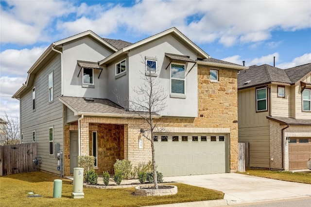 multi unit property featuring stucco siding, driveway, stone siding, fence, and an attached garage