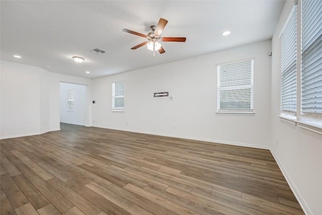 unfurnished room with visible vents, recessed lighting, a ceiling fan, and wood finished floors