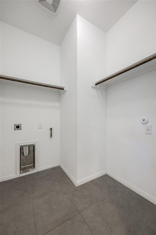 washroom with laundry area, electric dryer hookup, visible vents, and hookup for a gas dryer