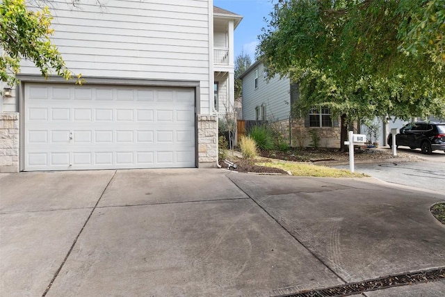 exterior space featuring concrete driveway