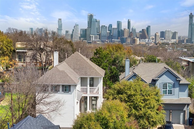 birds eye view of property with a view of city