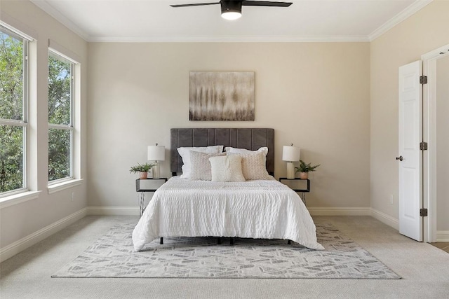 carpeted bedroom with baseboards, multiple windows, and crown molding