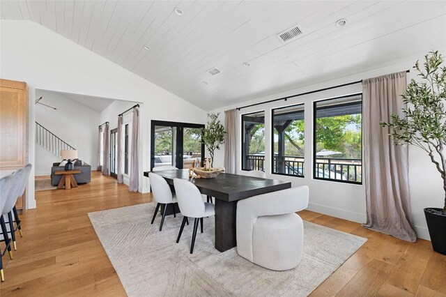 dining room featuring visible vents, stairway, french doors, wooden ceiling, and light wood finished floors