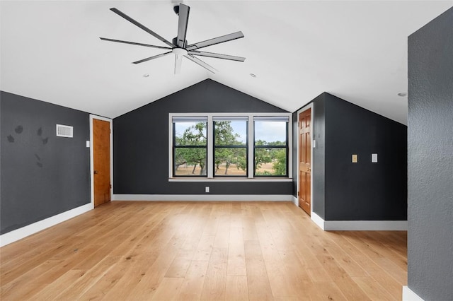 bonus room featuring light wood finished floors, visible vents, ceiling fan, baseboards, and lofted ceiling