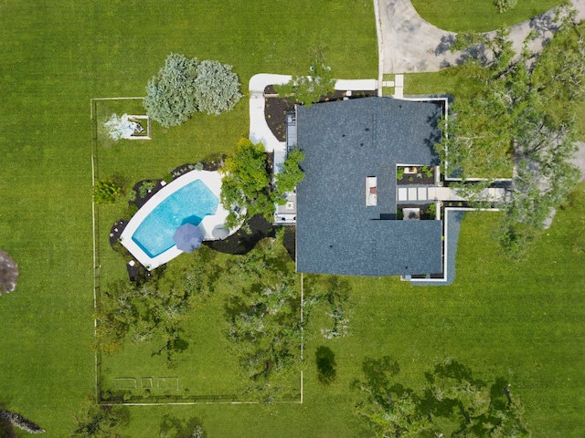 aerial view of property and surrounding area with a pool area