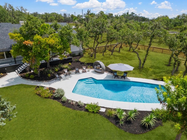 view of swimming pool with a patio and a wooden deck