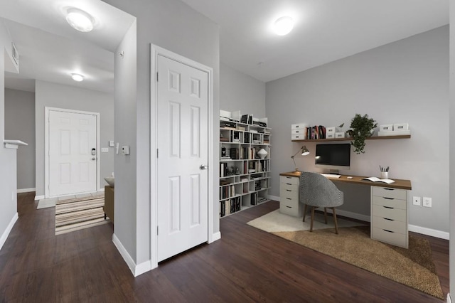 home office featuring wood finished floors and baseboards