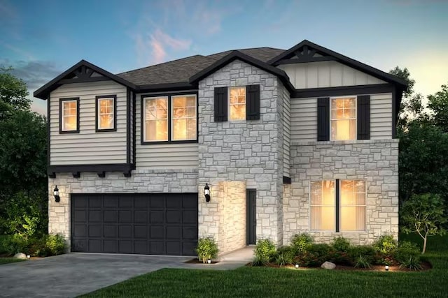 view of front of home featuring concrete driveway, an attached garage, and board and batten siding