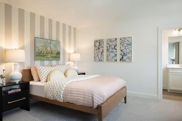 bedroom featuring baseboards, carpet flooring, and wallpapered walls