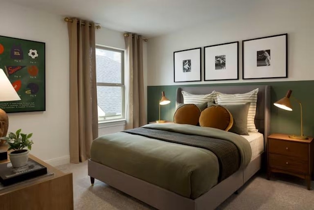 bedroom featuring light colored carpet and baseboards