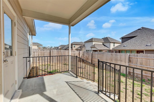 balcony with a patio and a residential view