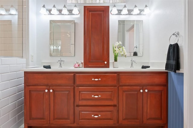 bathroom with double vanity and a sink