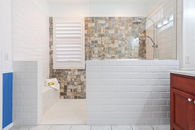 bathroom with vanity and a walk in shower