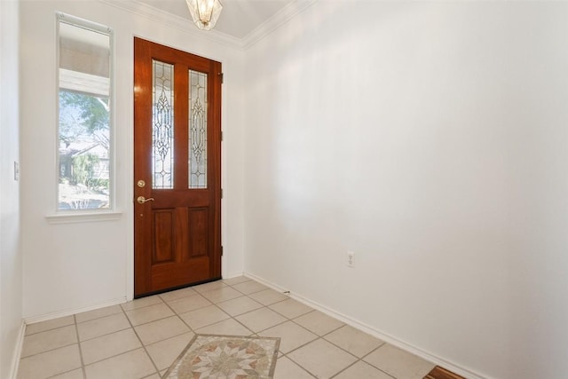 foyer entrance featuring light tile patterned floors, baseboards, and ornamental molding