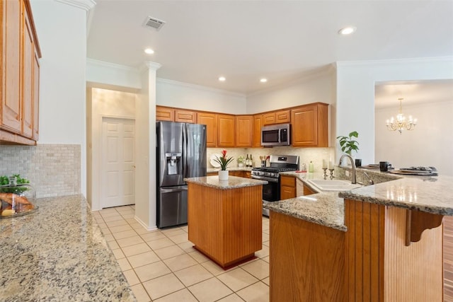 kitchen featuring a sink, stainless steel appliances, a peninsula, light tile patterned floors, and light stone countertops