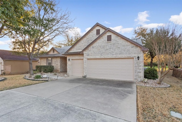 view of front of property with a garage and driveway