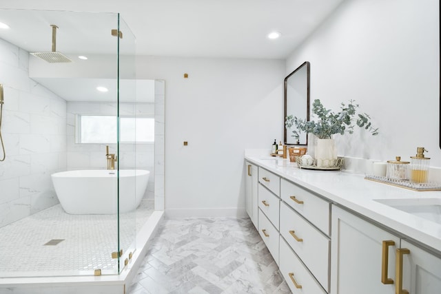 full bathroom featuring a shower stall, double vanity, recessed lighting, a soaking tub, and marble finish floor