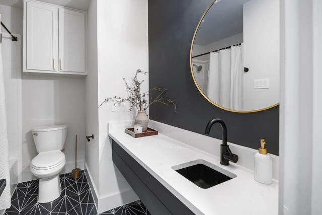1209 Lost Creek Blvd, Austin, TX 78746 - full bathroom with toilet, vanity, a shower with curtain, tile patterned flooring, and baseboards