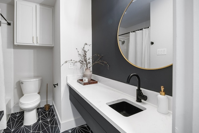 1209 Lost Creek Blvd, Austin, TX 78746 - bathroom featuring vanity, toilet, baseboards, and tile patterned flooring