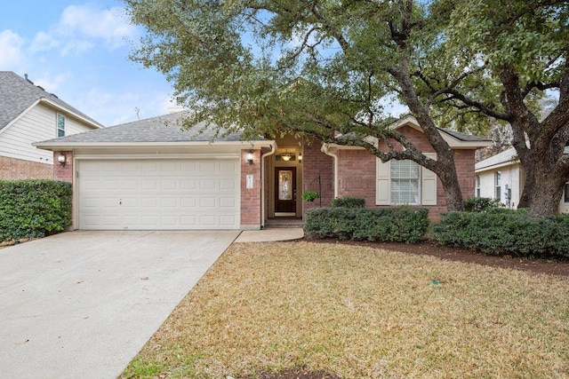 single story home featuring a front yard, a garage, brick siding, and driveway