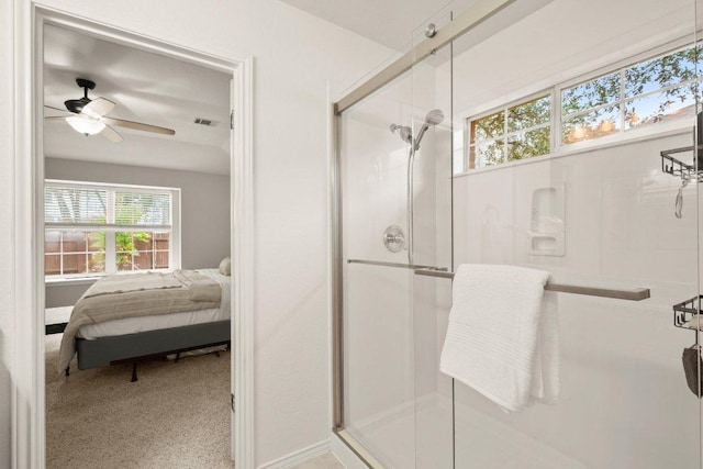 ensuite bathroom featuring visible vents, a ceiling fan, connected bathroom, and a shower stall