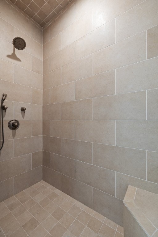 bathroom featuring a tile shower