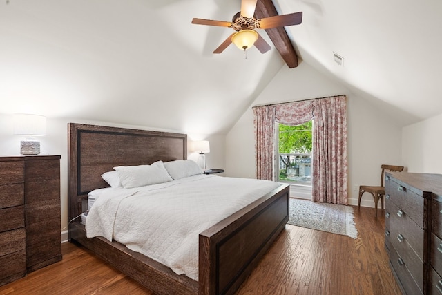 bedroom with lofted ceiling with beams, visible vents, baseboards, and wood finished floors