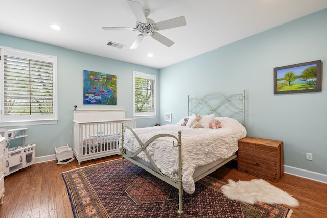 bedroom featuring recessed lighting, visible vents, baseboards, and wood finished floors