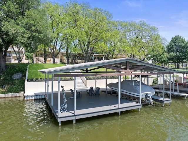 view of dock with boat lift and a water view