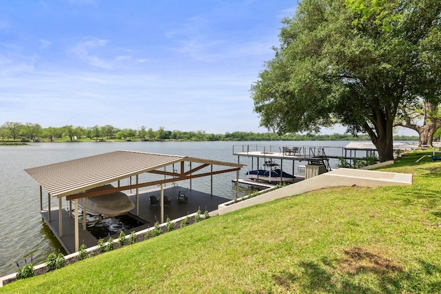 view of dock featuring a lawn, a water view, and boat lift