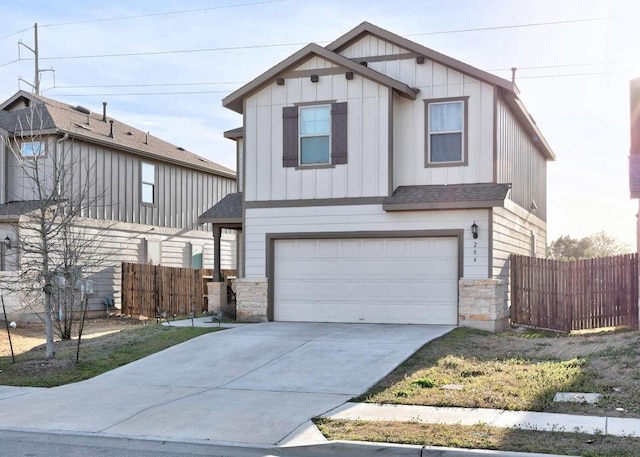 craftsman inspired home with stone siding, board and batten siding, driveway, and fence