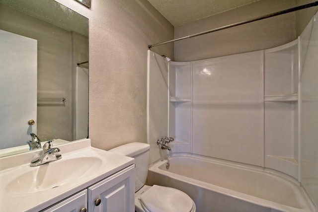 bathroom featuring toilet, vanity, bathtub / shower combination, a textured wall, and a textured ceiling