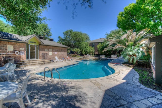 pool featuring a patio area