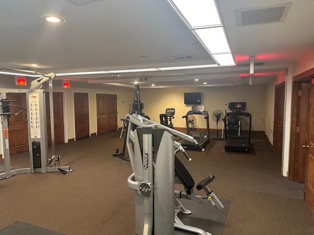 workout area with visible vents and carpet floors