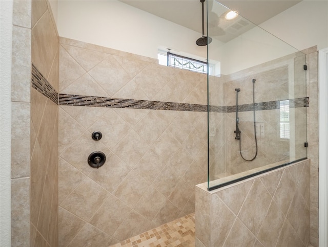 full bathroom featuring a walk in shower