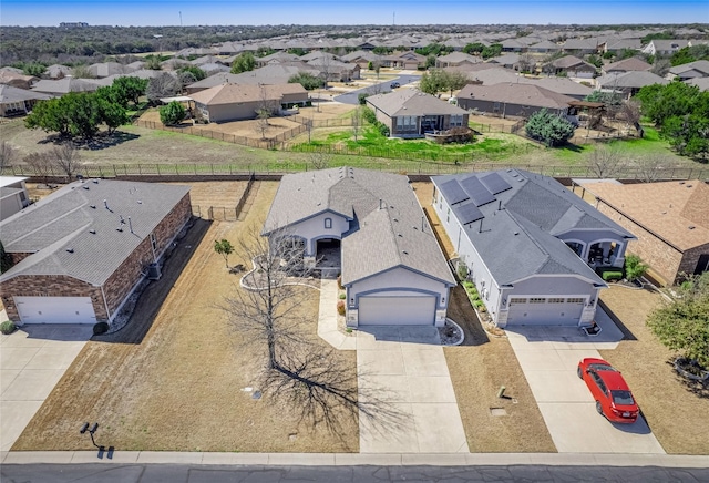 birds eye view of property with a residential view