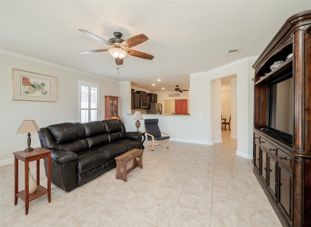 living room featuring visible vents, baseboards, ornamental molding, light tile patterned floors, and a ceiling fan